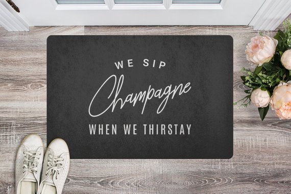 We Sip Champagne Welcome Mat