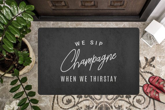 We Sip Champagne Welcome Mat