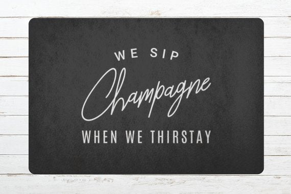 We Sip Champagne Welcome Mat