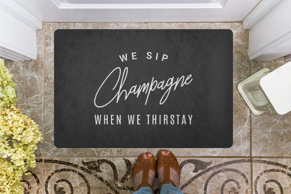 We Sip Champagne Welcome Mat
